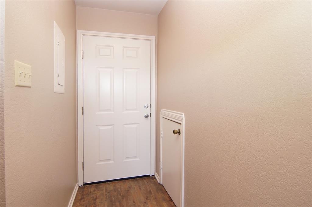 3109 Hells Gate Loop, Unit 59 Strawn, TX 76475 - Photo 8 of 25 a view of a hallway with wooden floor