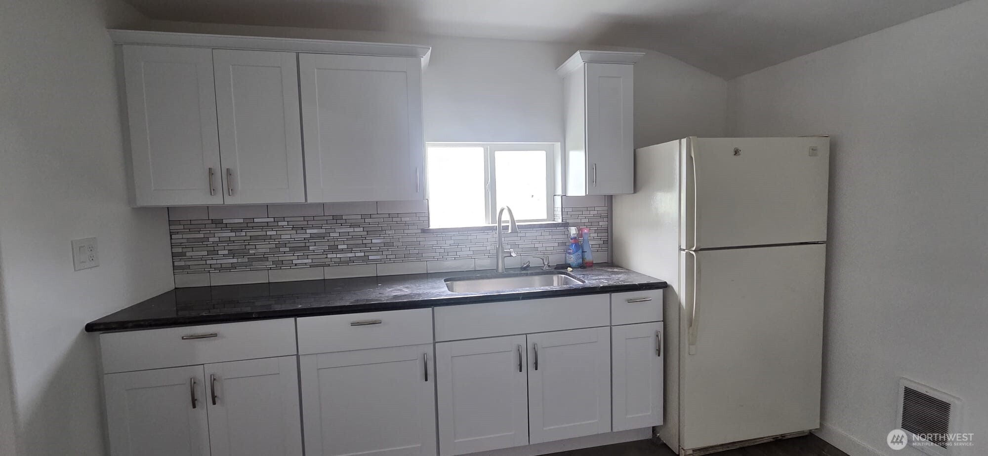 151 1st Avenue Hatton, WA 99344 - Photo 4 of 5 a kitchen with a refrigerator sink and cabinets