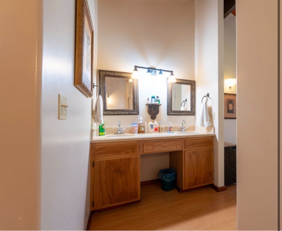 16-1339 Ao Rd Mountain View Mountain View, HI 96771 - Photo 14 of 24 a spacious bathroom with a double vanity sink and a mirror