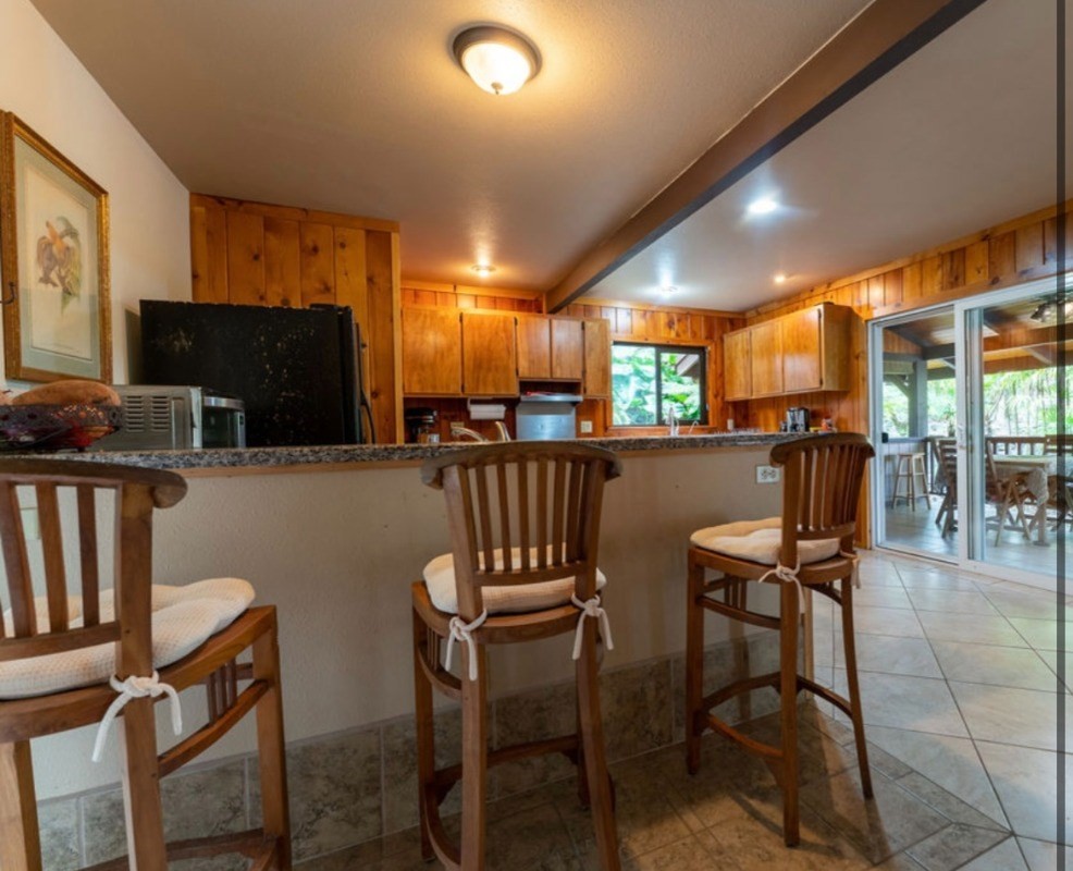 16-1339 Ao Rd Mountain View Mountain View, HI 96771 - Photo 7 of 24 a view of a dining room with furniture window and outside view
