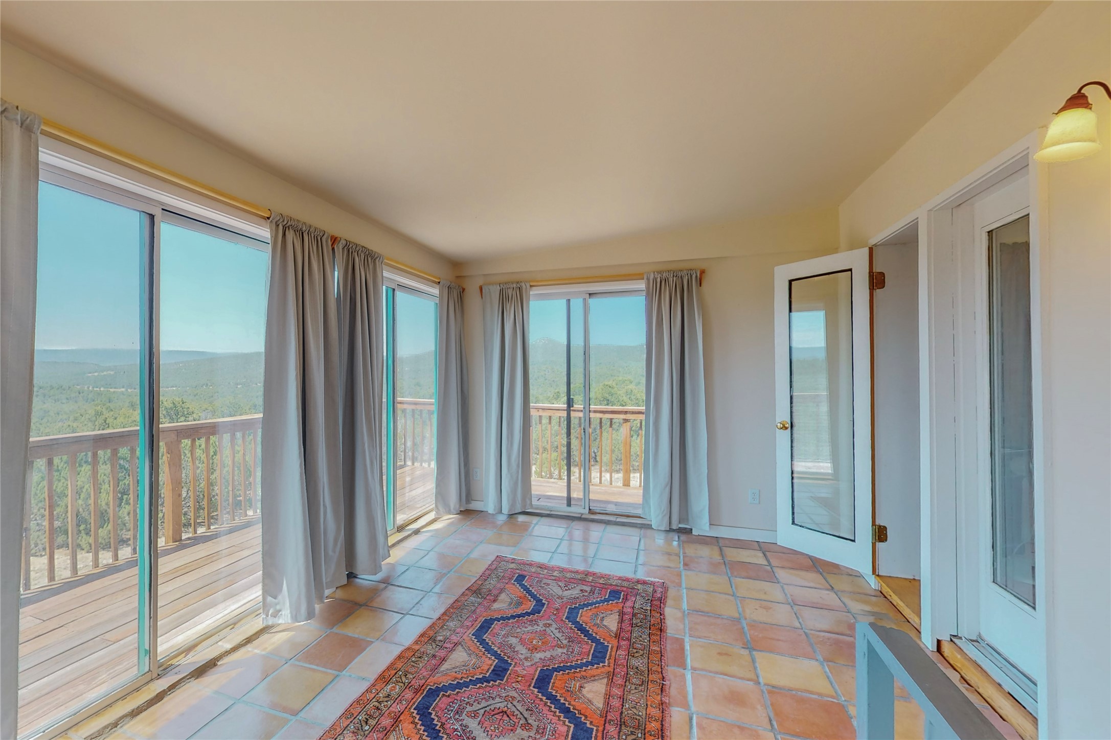 175 Hidden Valley Ranch Road Ilfeld, NM 87538 - Photo 24 of 43 Upper sunroom facing west
