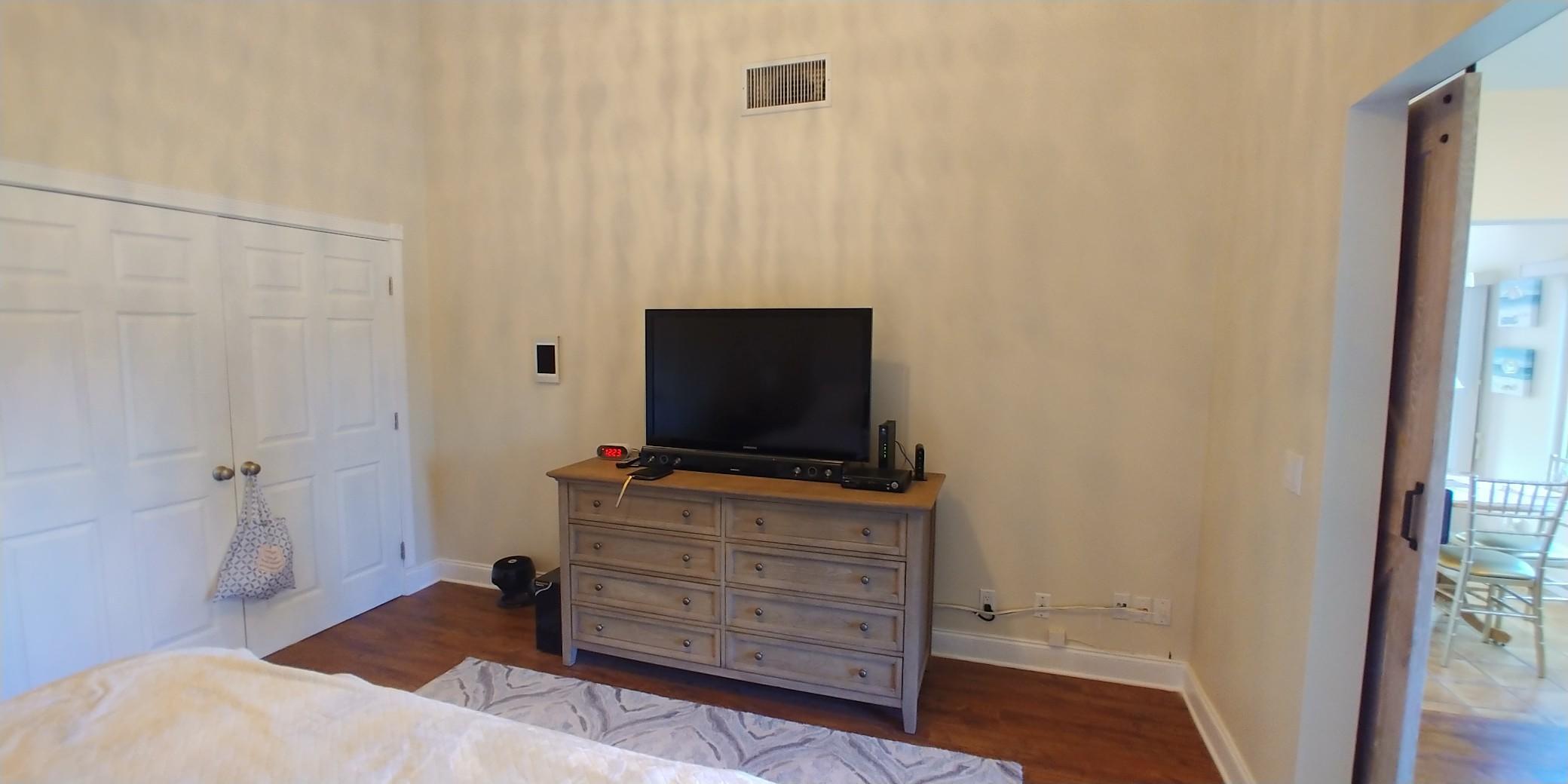 17042 Traverse Circle Jupiter, FL 33477 - Photo 16 of 30 a room with furniture and flat screen tv