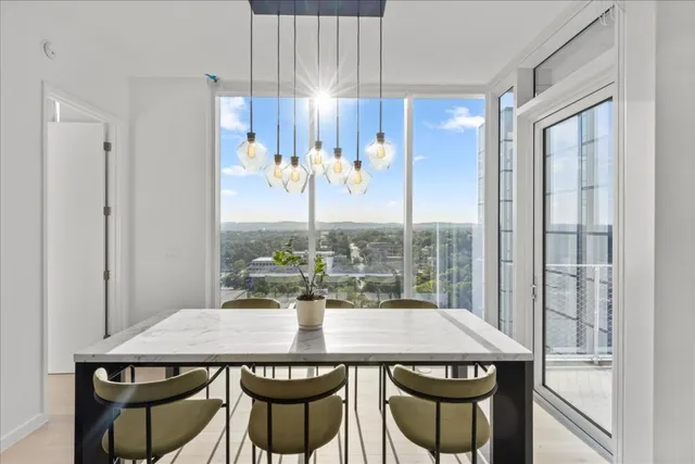 a view of a dining table and chairs in the room
