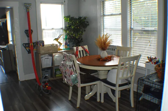 a view of a dining room with furniture and window
