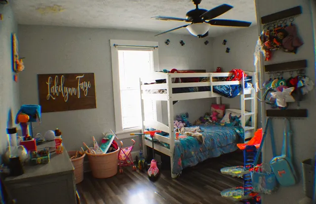 a bedroom with bed and a window