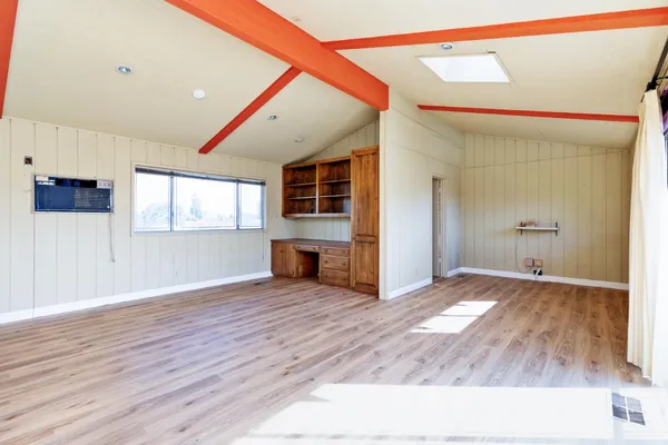 a bathroom with a tub and shower