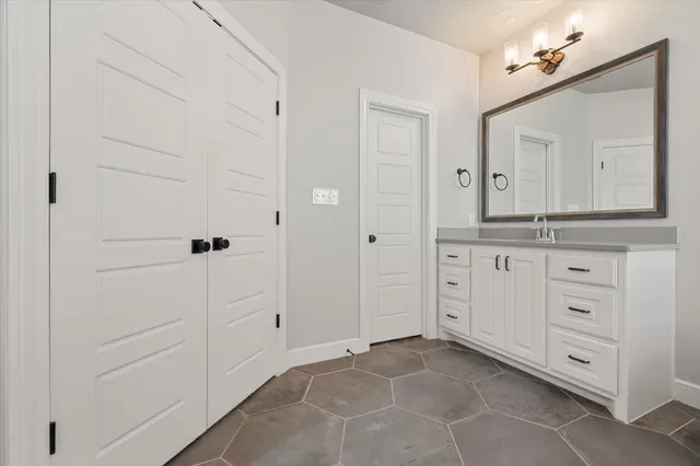 a bathroom with a bathtub and a sink