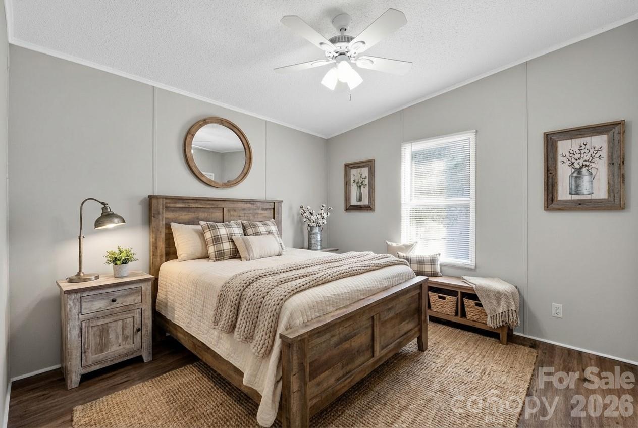 1118 Old Willis School Road Dallas, NC 28034 - Photo 14 of 17 a bedroom with a bed and a chandelier
