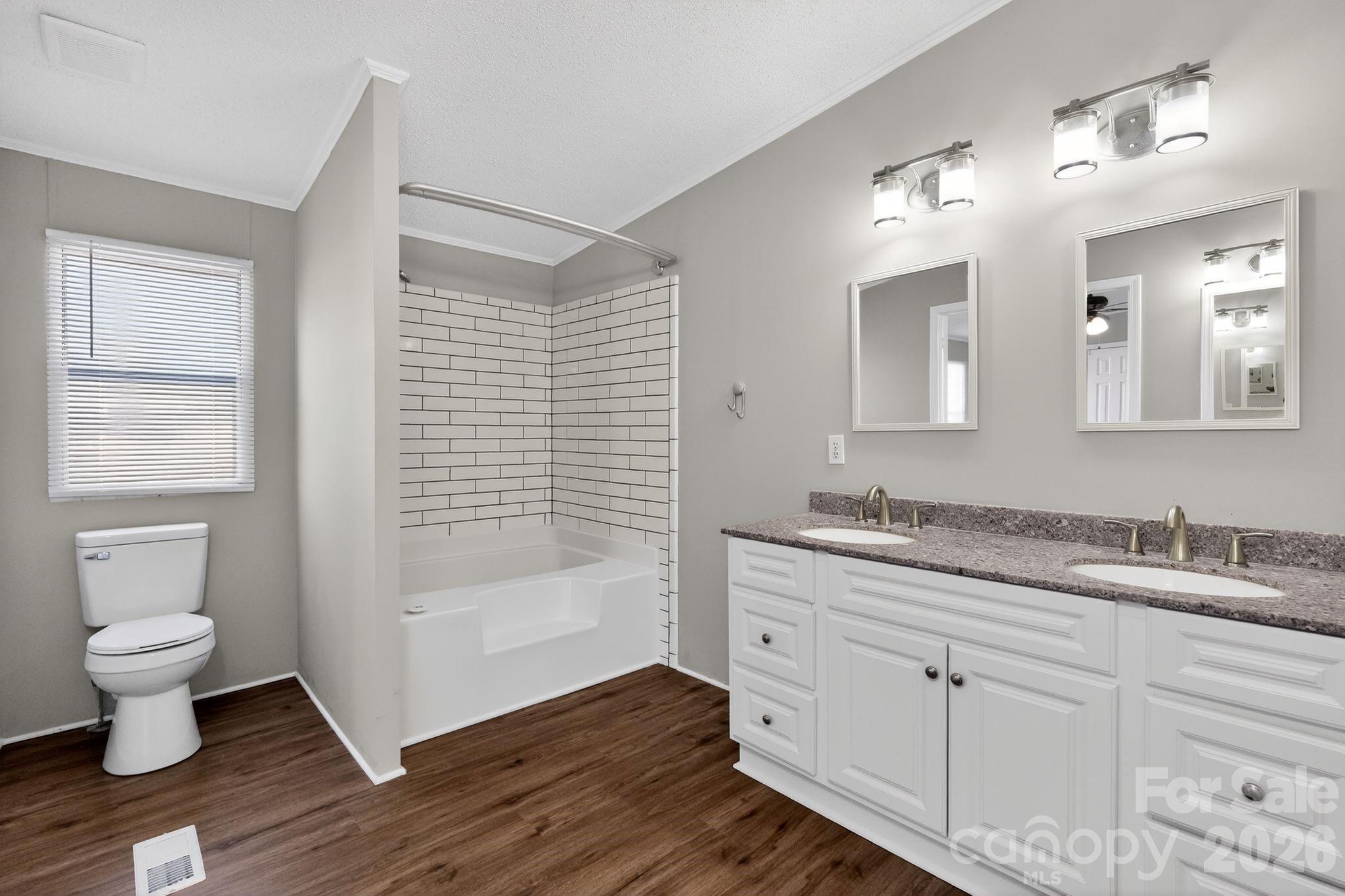 1118 Old Willis School Road Dallas, NC 28034 - Photo 15 of 17 a bathroom with a granite countertop sink toilet and shower