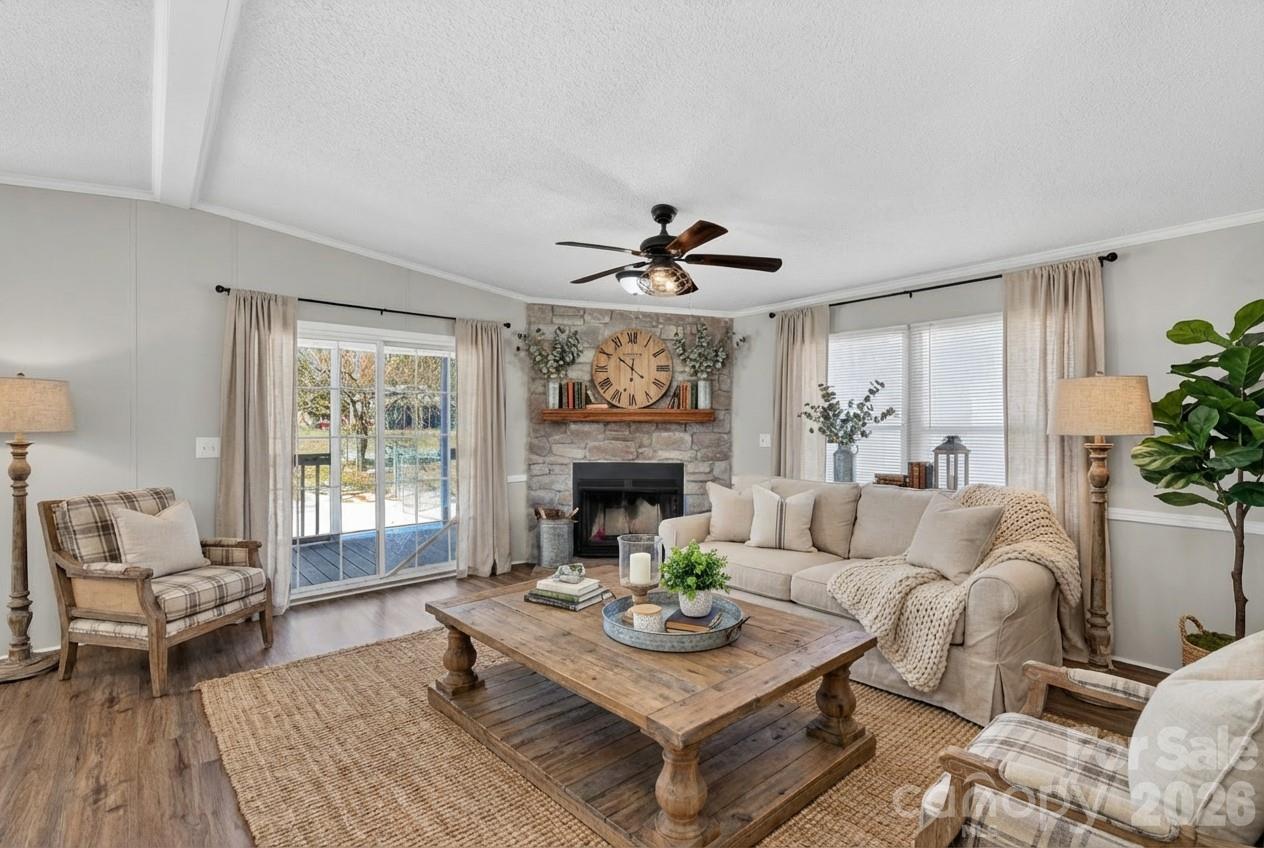 1118 Old Willis School Road Dallas, NC 28034 - Photo 3 of 17 a living room with furniture a fireplace and a large window