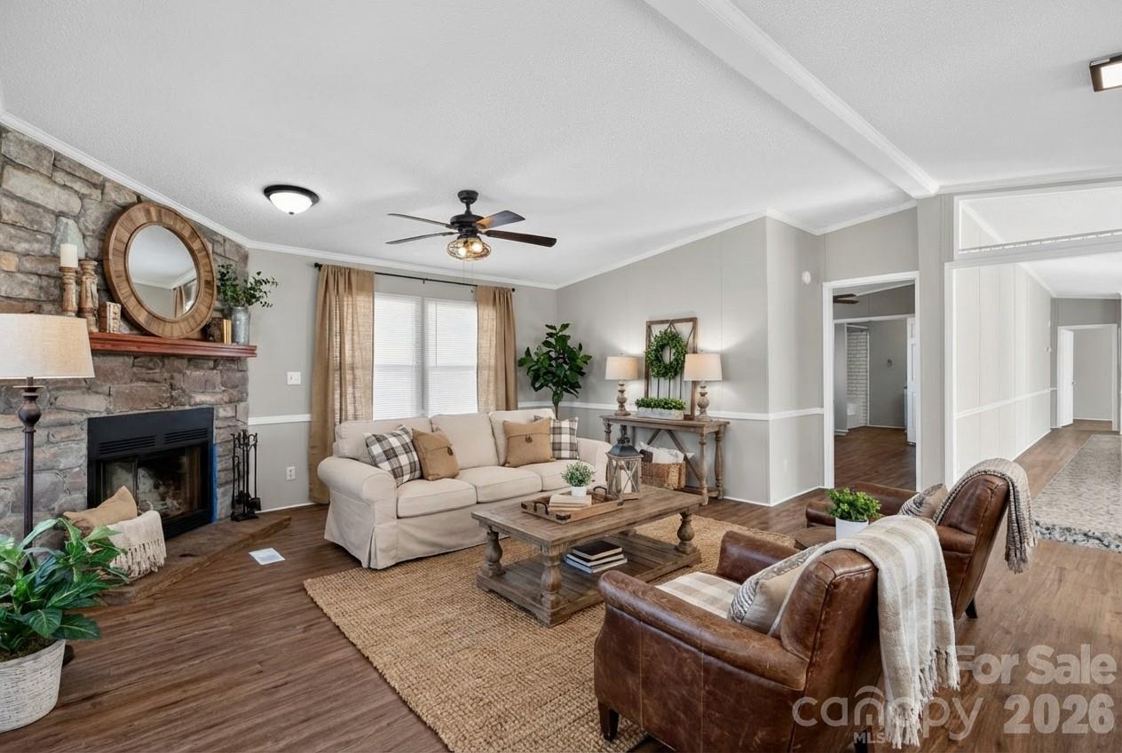1118 Old Willis School Road Dallas, NC 28034 - Photo 4 of 17 a living room with furniture a fireplace and potted plants
