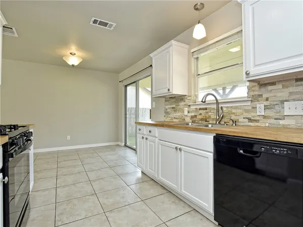 a kitchen with a sink and cabinets