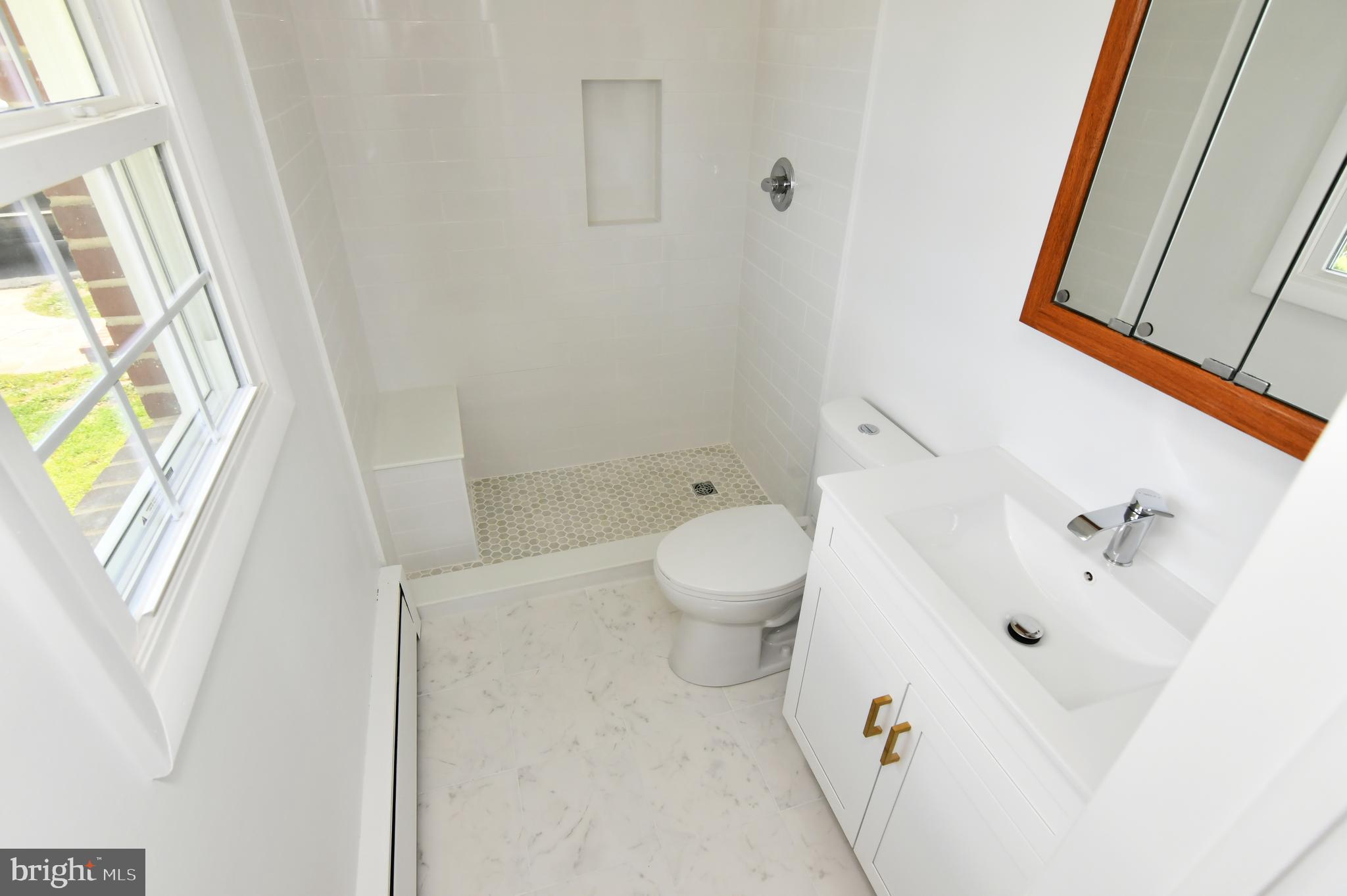 437 Beechcroft Road Winchester, VA 22601 - Photo 27 of 52 a bathroom with a bathtub sink and toilet