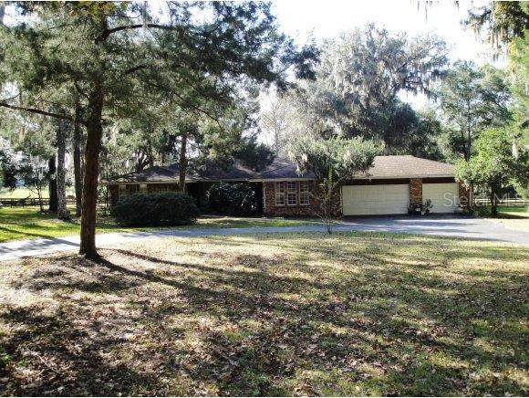 9350 Southwest 19th Avenue Road Ocala, FL 34476 - Photo 1 of 1 a house view with a swimming pool
