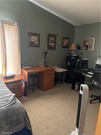 a bed room with a bed and a window