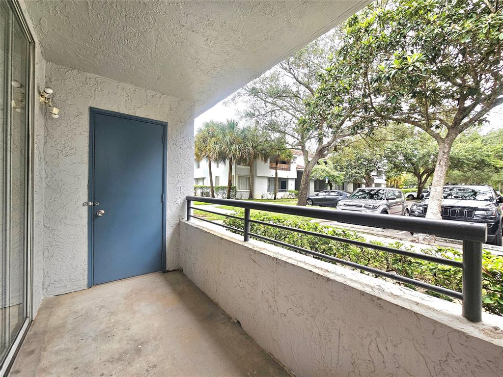 631 Lyons Road, Unit 12105 Coconut Creek, FL 33063 - Photo 12 of 26 a view of a house with a large trees