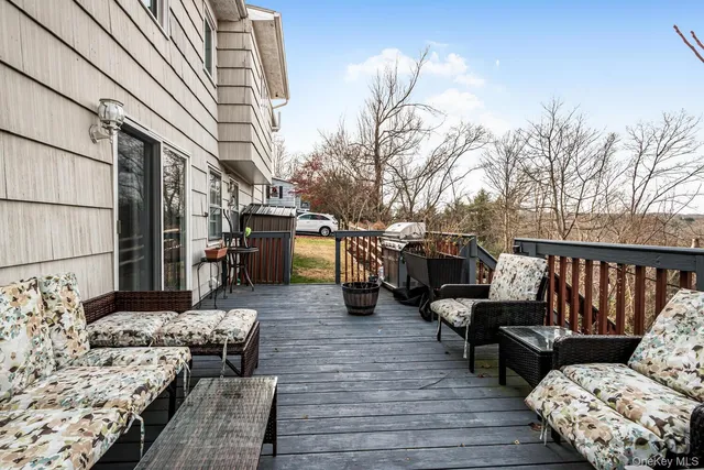 a view of a patio with couches and potted plants