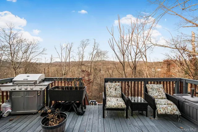 a view of a chairs and tables in the balcony