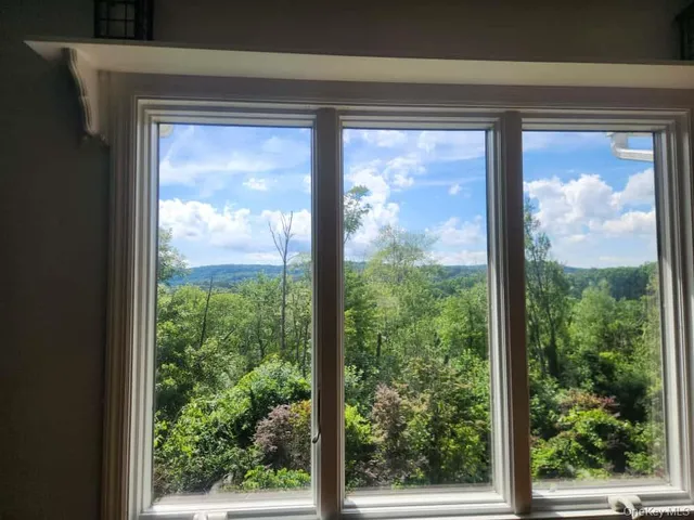 a view of a room with a large window