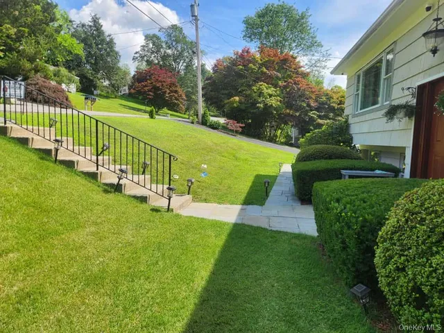 a view of a garden with deck