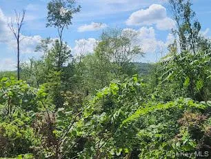 a view of a chair and table in the patio