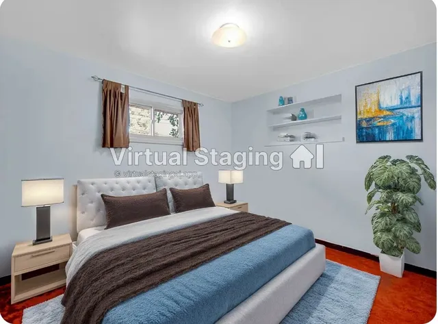 a bedroom with bed and painting on the wall