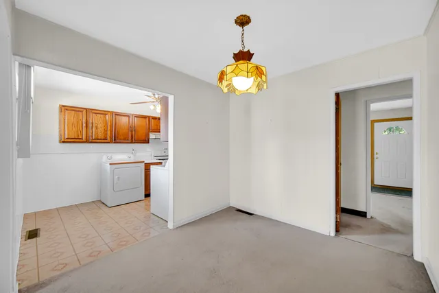 a view of a kitchen with a microwave and a stove