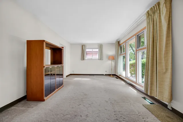 an empty room with windows