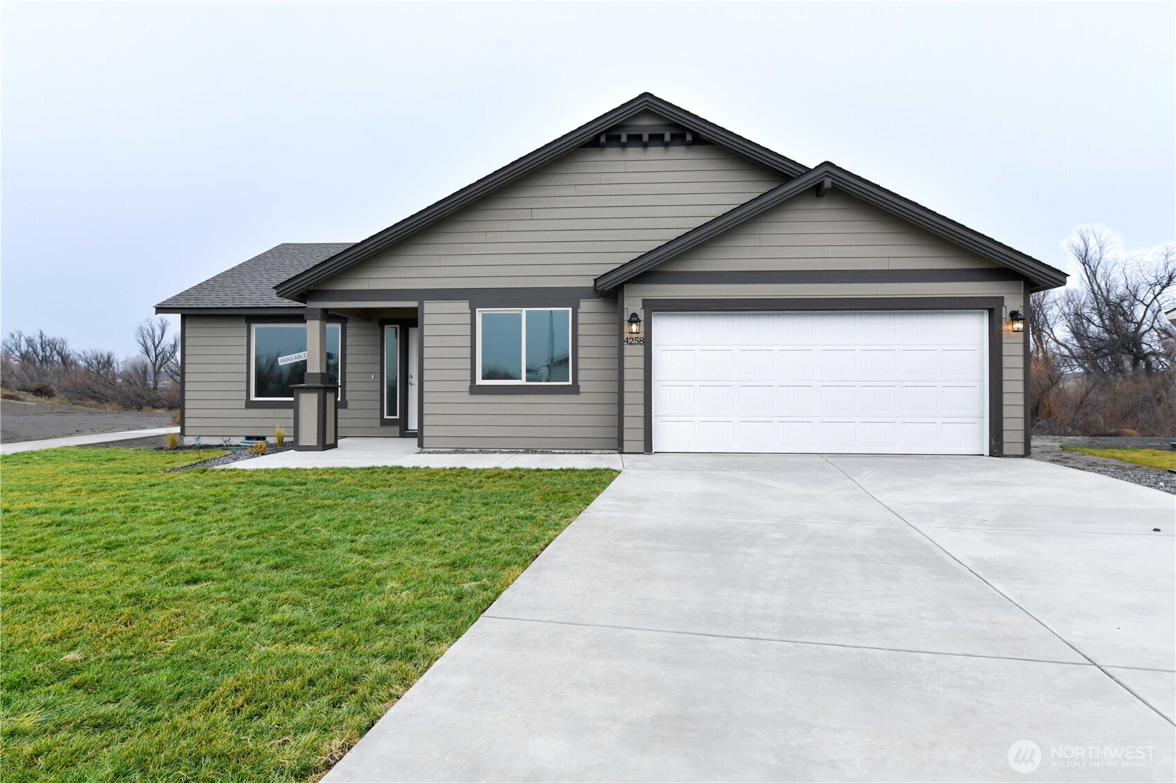 4258 Sandy Street Moses Lake, WA 98837 - Photo 1 of 19 a front view of house with yard and green space