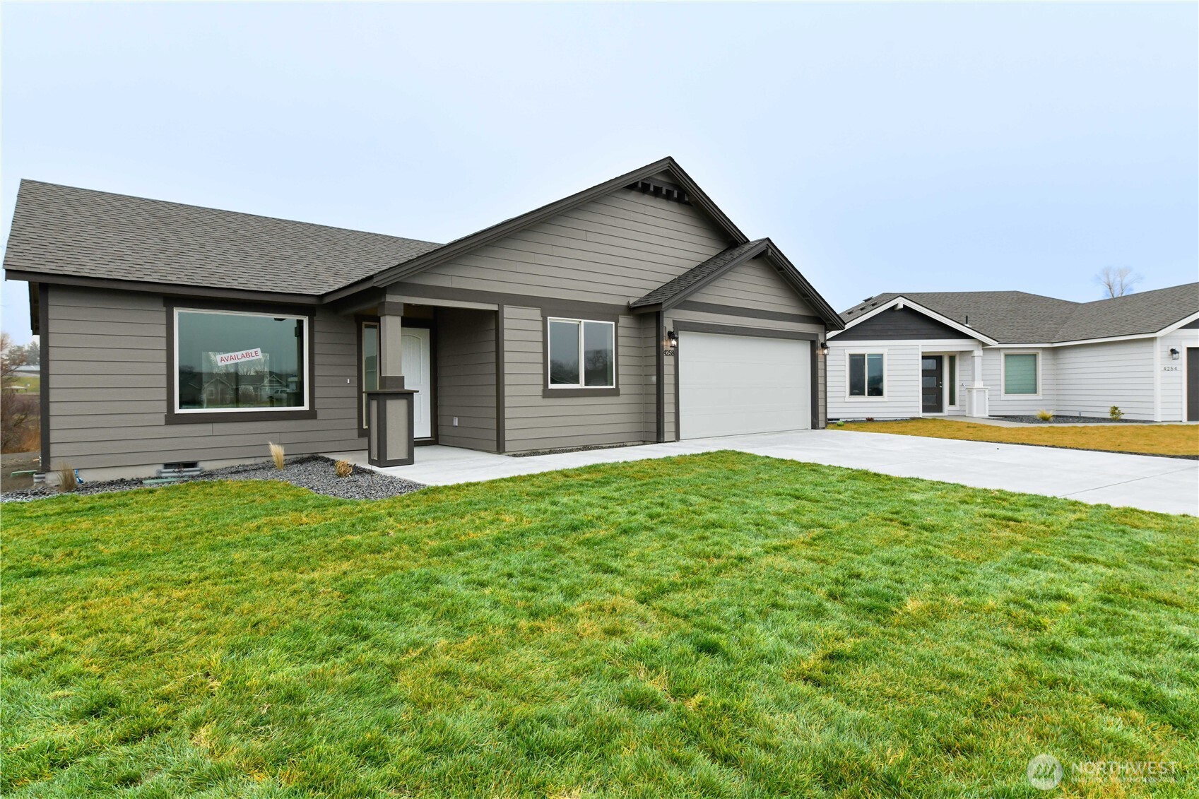 4258 Sandy Street Moses Lake, WA 98837 - Photo 2 of 19 a house view with a garden space