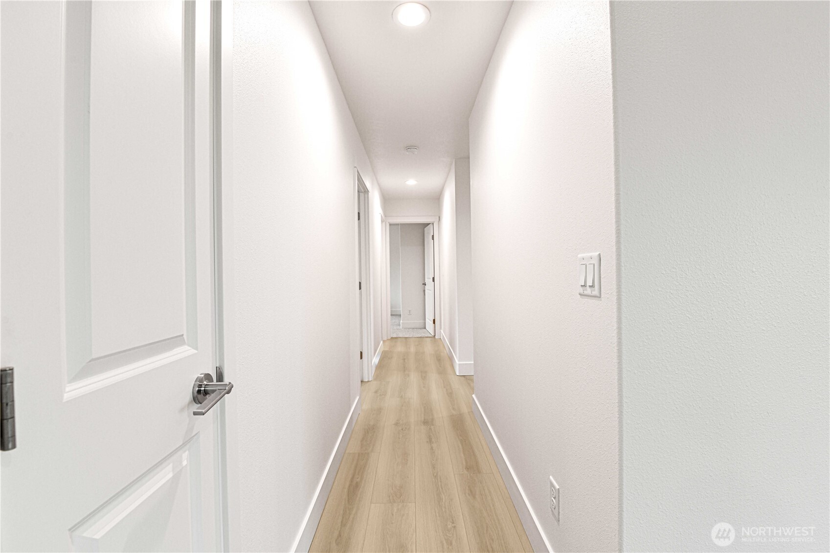 4258 Sandy Street Moses Lake, WA 98837 - Photo 9 of 19 a view of a hallway with wooden floor