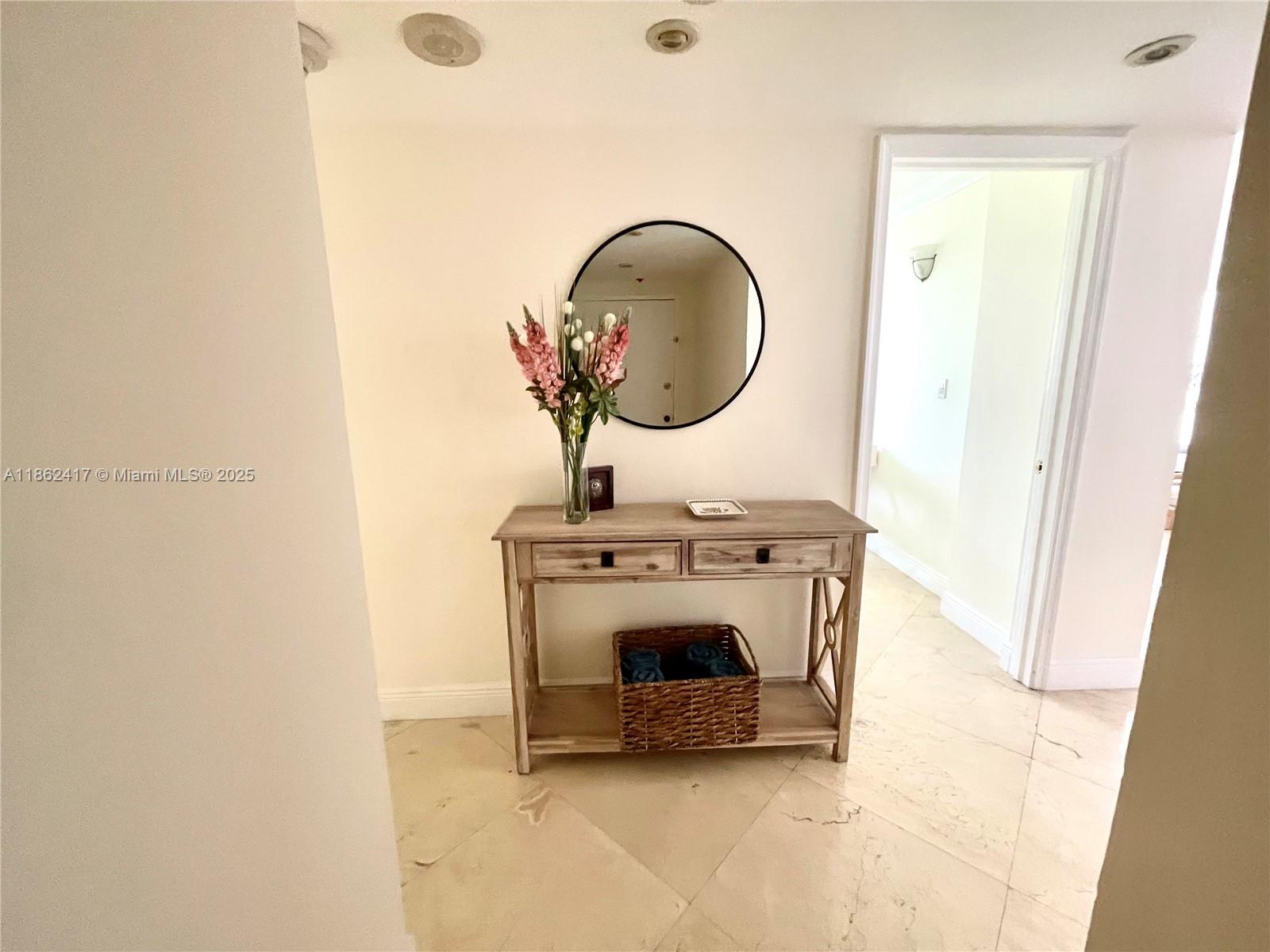 177 Ocean Ln Drive, Unit 209 Key Biscayne, FL 33149 - Photo 19 of 19 a living room with a sink and a mirror