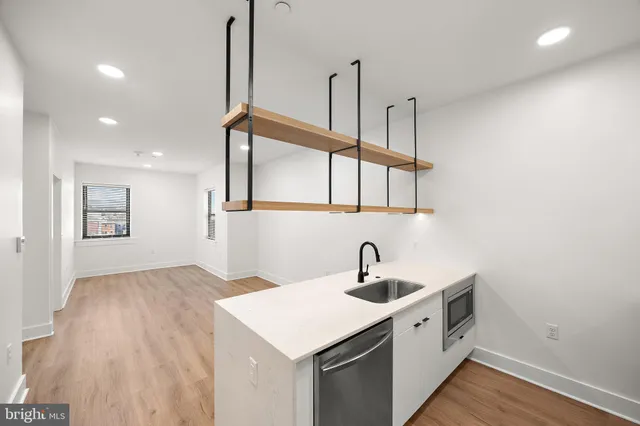 a kitchen with a sink and cabinets