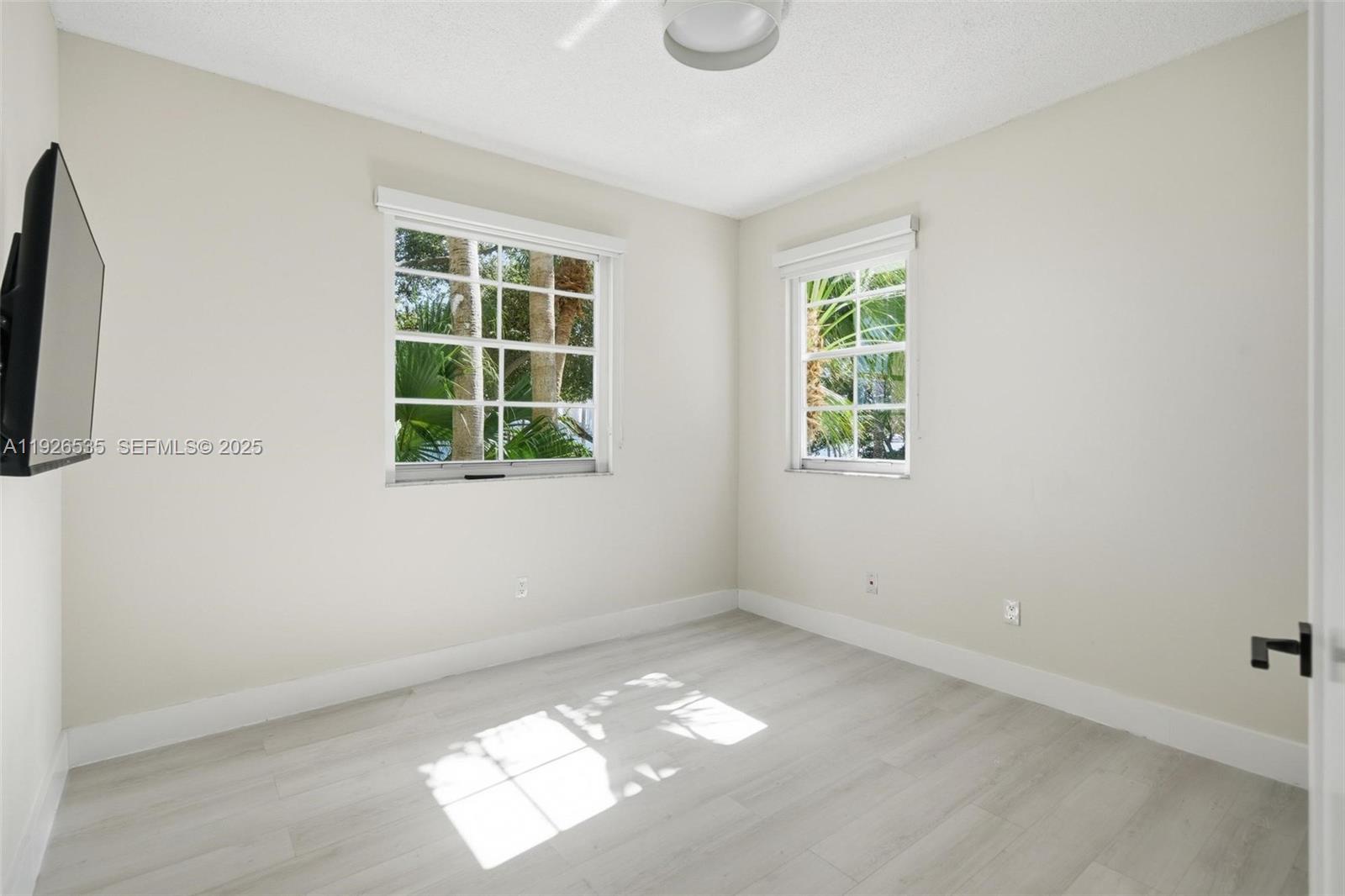 3255 Northeast 184th Street, Unit 12210 Aventura, FL 33160 - Photo 14 of 17 an empty room with a window