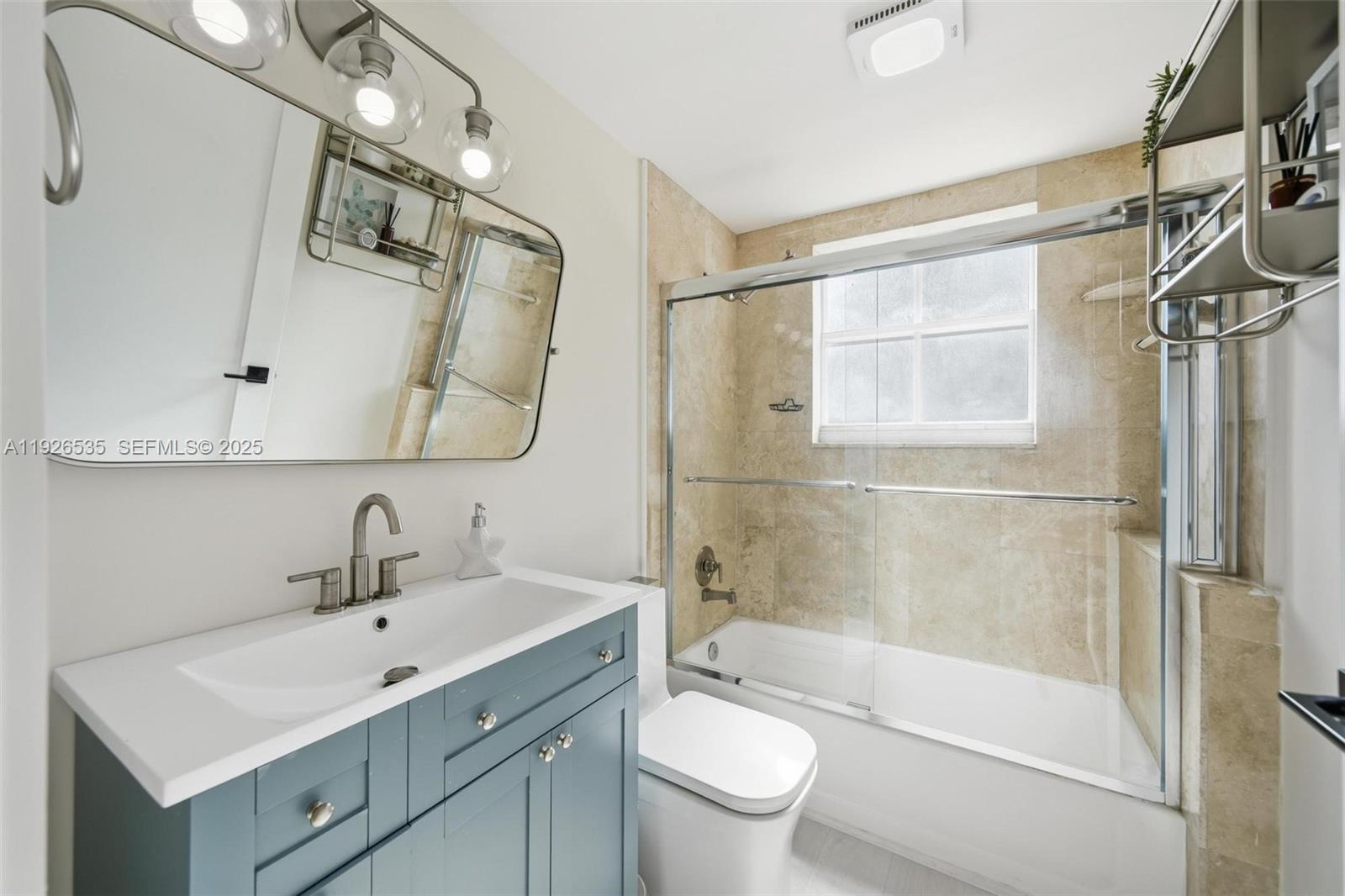3255 Northeast 184th Street, Unit 12210 Aventura, FL 33160 - Photo 16 of 17 a bathroom with a sink toilet and shower