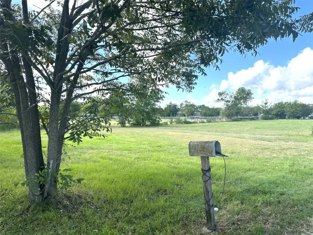 a view of a lake with a yard