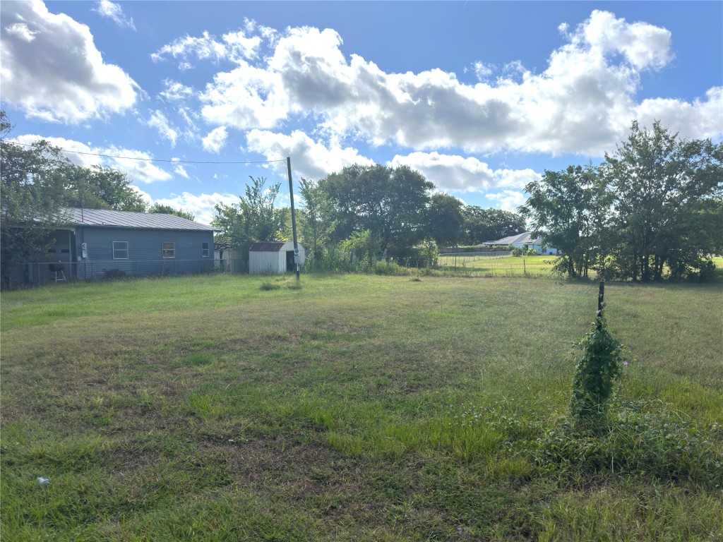 1112 Old Nails Creek Road Giddings, TX 78942 - Photo 4 of 5 a view of a field with an trees in the background