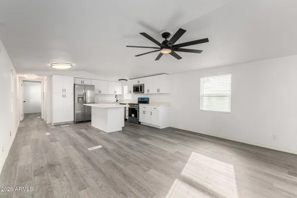 a view of a kitchen with a sink cabinets and window