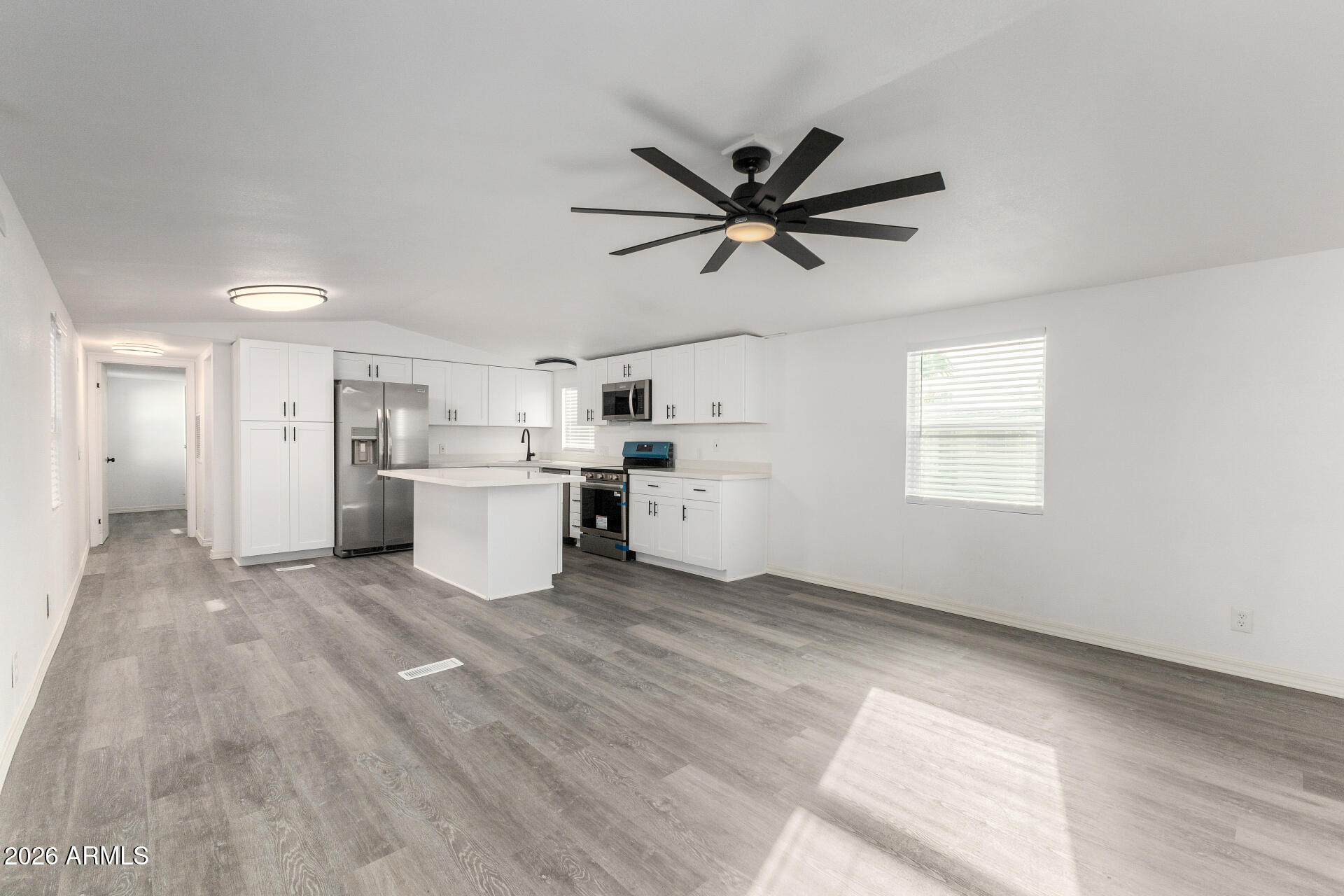 a view of a kitchen with a sink cabinets and window