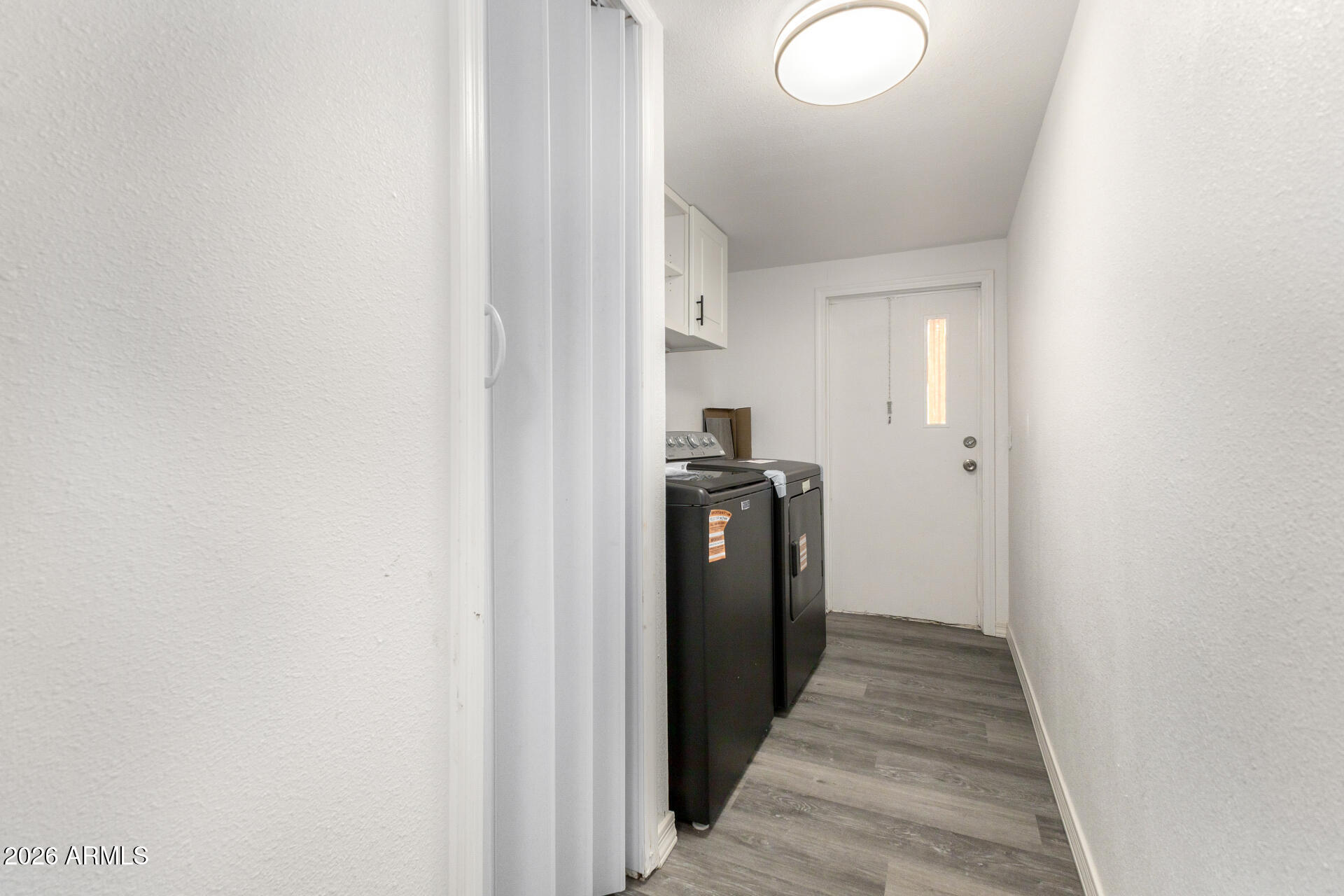 555 West Warner Road, Unit 125 Chandler, AZ 85225 - Photo 28 of 29 a view of a hallway with wooden floor