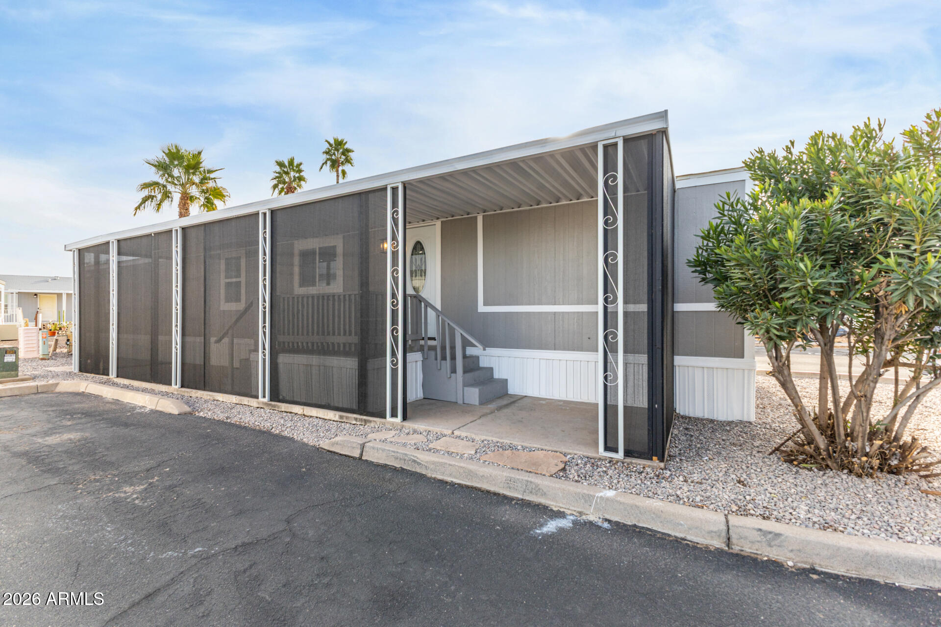 555 West Warner Road, Unit 125 Chandler, AZ 85225 - Photo 3 of 29 a view of entryway with wooden fence