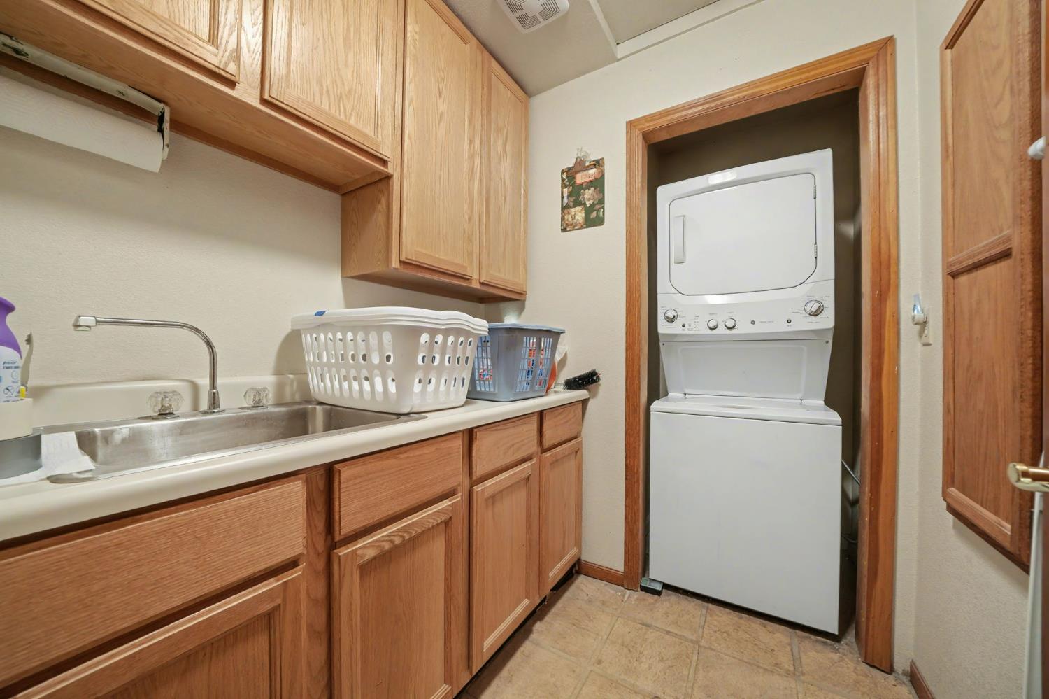 14899 Patton Road Plymouth, CA 95669 - Photo 25 of 52 Laundry Room With Sink And Built-In Ironing Board