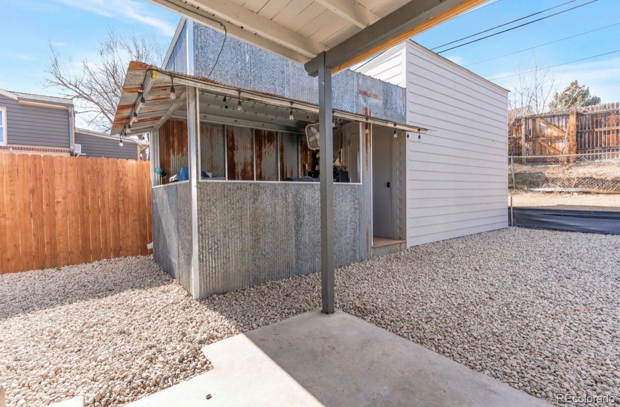 9271 Travis Street Thornton, CO 80229 - Photo 24 of 25 a view of a porch