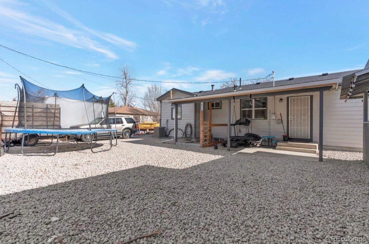 9271 Travis Street Thornton, CO 80229 - Photo 25 of 25 a view of a house with a patio