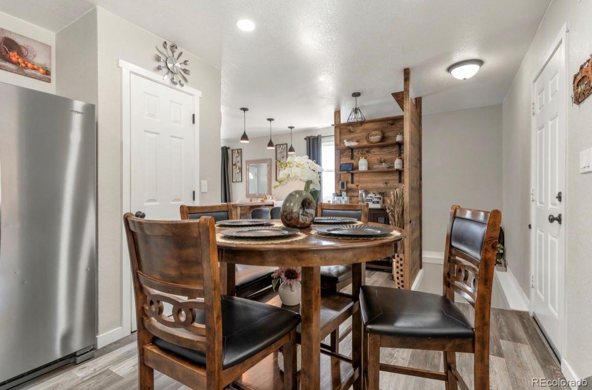 9271 Travis Street Thornton, CO 80229 - Photo 6 of 25 a view of a dining room with furniture