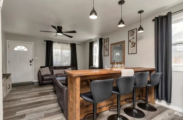 a dining room with furniture and window