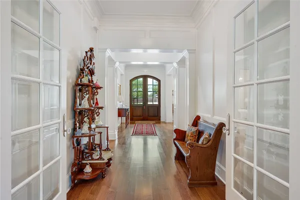 a living room with furniture a fireplace and wooden floor