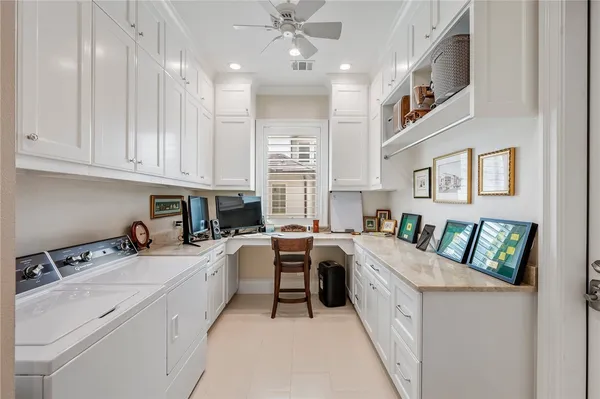 a kitchen with a stove sink and cabinets