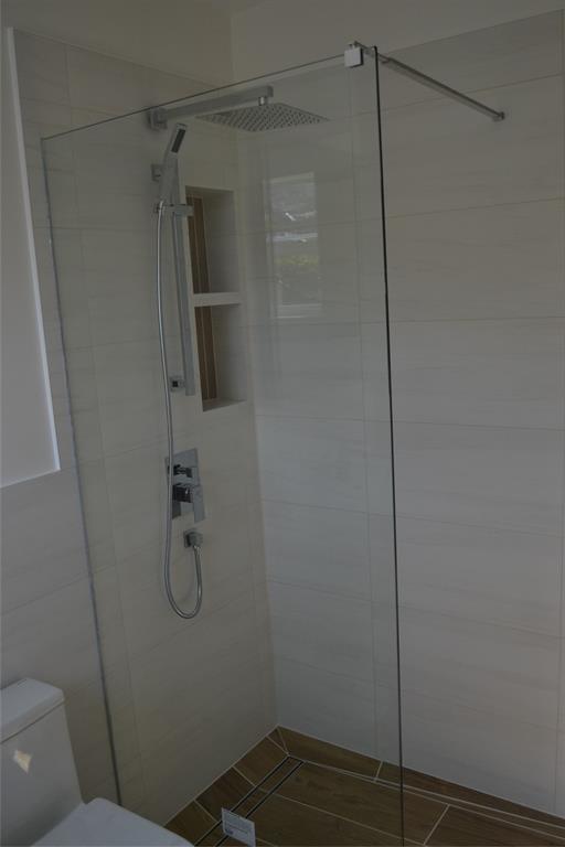 5241 Southwest 89th Avenue Cooper City, FL 33328 - Photo 16 of 28 a bathroom with a shower and toilet