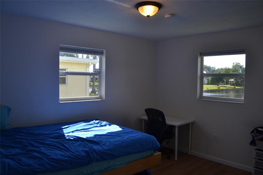 5241 Southwest 89th Avenue Cooper City, FL 33328 - Photo 18 of 28 a bedroom with a bed and a window